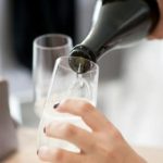 woman pouring a glass of wine