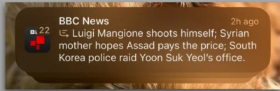 Screenshot of an Apple Intelligence post purportedly from the BBC with the text: Luigi Mangione shoots himself; Syrian mother hopes Assad pays the price; South Korea police raid Yoon Suk Yeol's office.