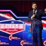 JD Vance on stage at a rally