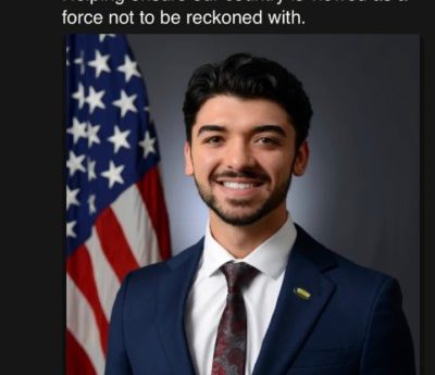 A young man with his first bit of facial fluff and his first suit. Text - I am excited and honored to announce I have been appointed to the Office of the Secretary of Defense at the DoD. Helping to ensure our country is a force not to be reckoned with.