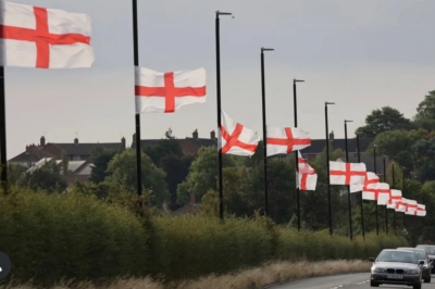 St George flags on lampposts along the side of a road