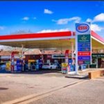 A petrol station on a bright sunny day.
